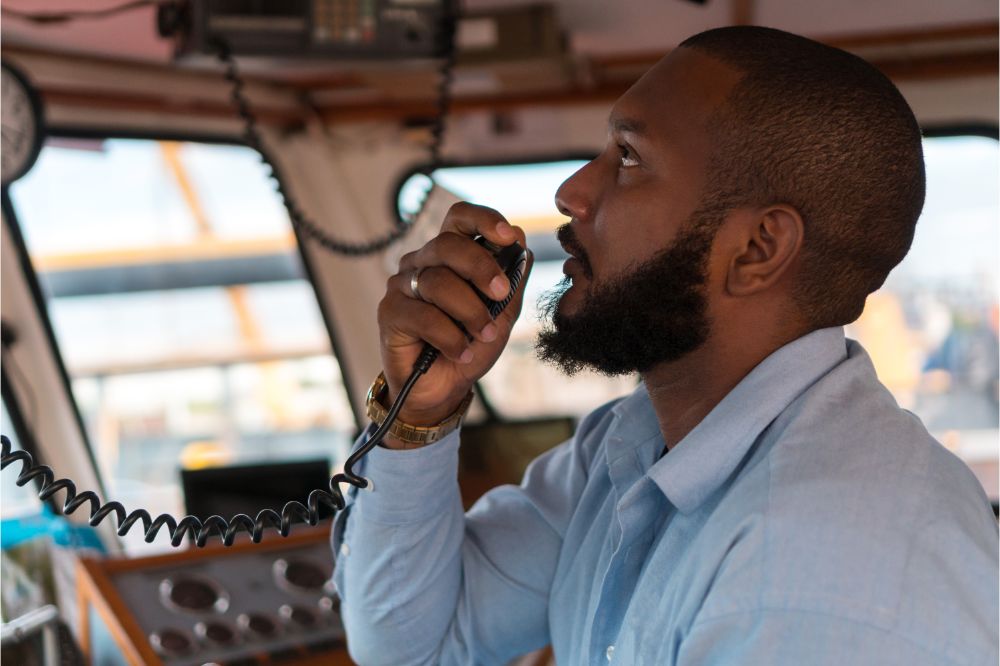 captain part of the crew of the boat that performs daily tasks with VHF radio