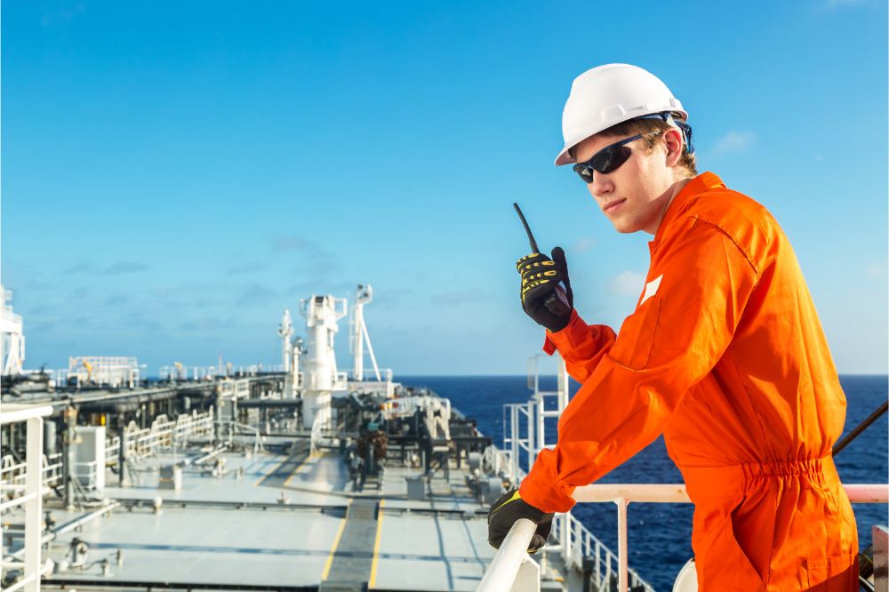 deck officer using radio on the board of a tanker