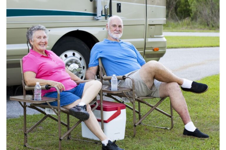 RV Seniors sitting on chairs with ice chest cooler